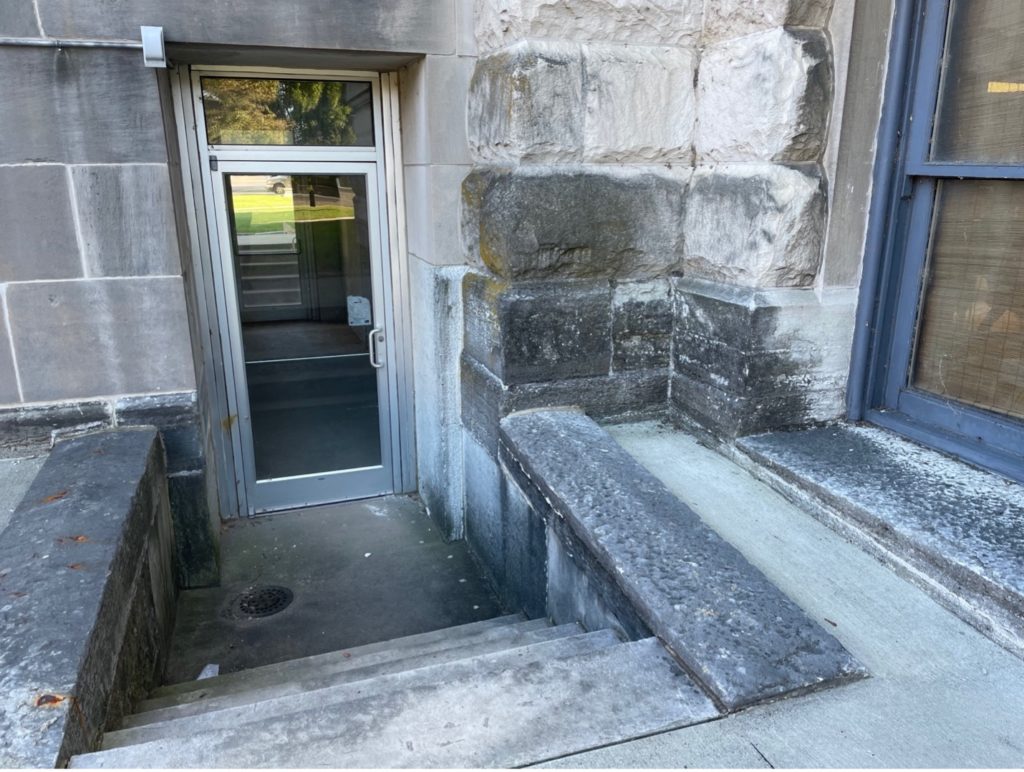 stairs leading down into a courthouse door