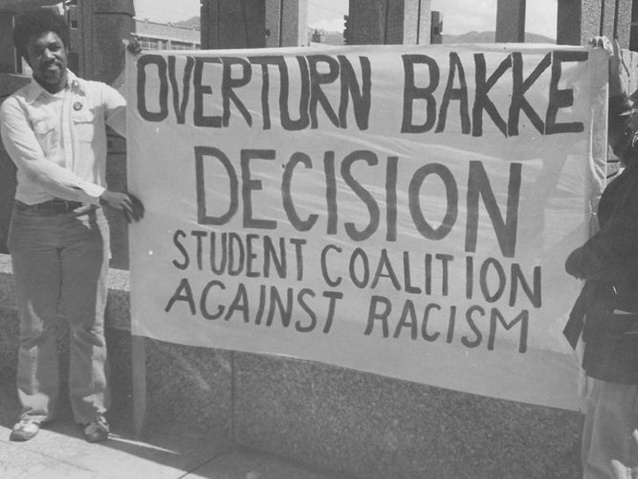 Tony holding large sign reading "Overturn Bakke Decision"