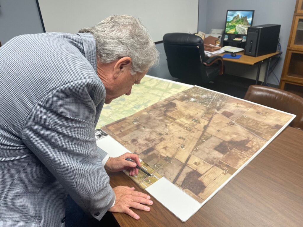 Prosecutor Chipman looking at a map of unsolved murders.