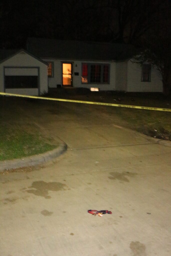 This is a photo of the crime scene where keys at the end of the driveway were recovered by officers. They belonged to a partygoer who dropped them while running from the shooting and returned to the owner that same night.