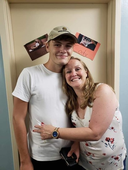 Angie with Cody outside his college dorm.
