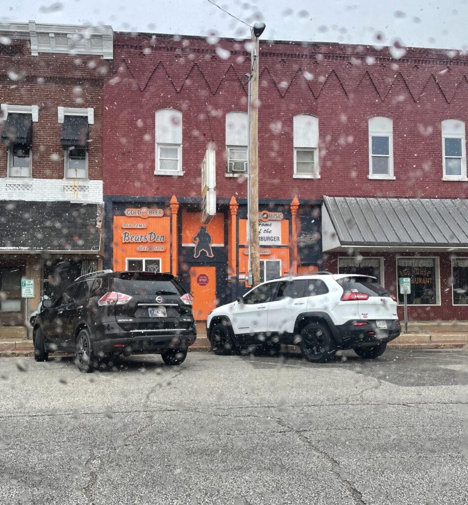 Two vehicles parked outside of the Bears Den in Argos.