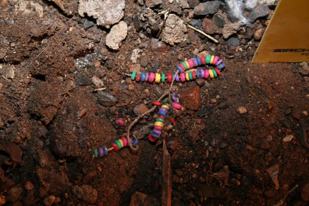 Beaded necklace found during 2013 search of Duane Cornwell’s old garage.