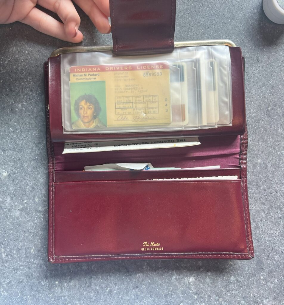 Ada's wallet and ID were found in the purse on her dresser; items provided by family.