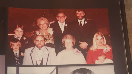 From left to right: George’s sons (Michael and George III), George, George’s parents, George’s wife (Linda), George’s sister’s ex-husband, George’s sister & her daughter.