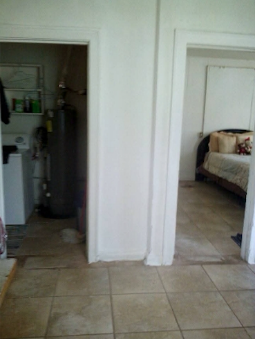 A view of the doorways connecting the utility room (left) and Luther’s bedroom (right) to the kitchen, where the photograph was taken. This photo was taken in October 2015.