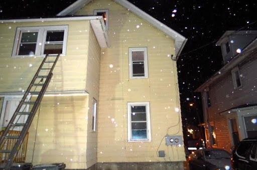 An evidence photo of outside 193-195 Leighton Ave. in the hours after the murders.