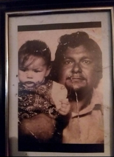 A portrait of Tammy Meshell (left) as a toddler and her father, Luther (right).