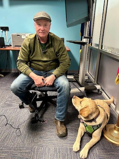 Retired Rochester Investigator John Brennan and his dog, Grace.