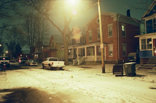 Original crime scene photos of the driveway and neighborhood where Roger McCall was shot and killed back in 2003.