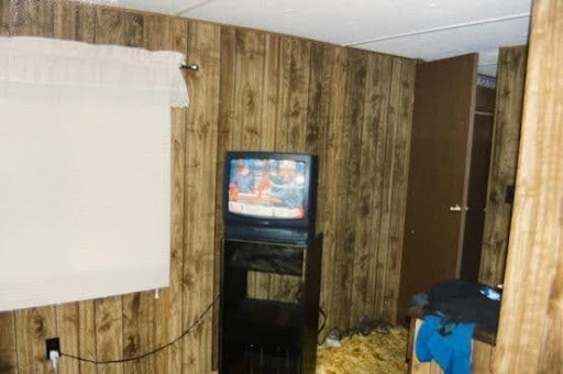 Original crime scene photos from 2002 of Robert’s mobile home where he was shot and killed.