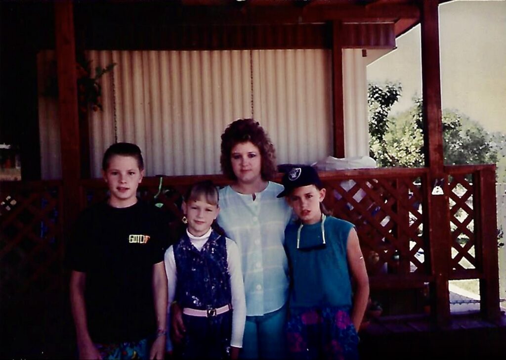 A photo of Tawnya Dawn Knight with her brother Chris, mother Lori, and brother Wayne. Courtesy of: Lori Knight
